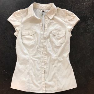 Fitted cream blouse with shoulder details